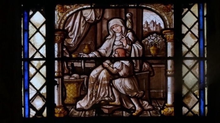 Saint Urbain près de sa mère qui file la laine avec une quenouille