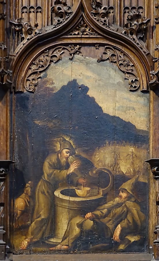 François bénit de l’eau prise dans un puits